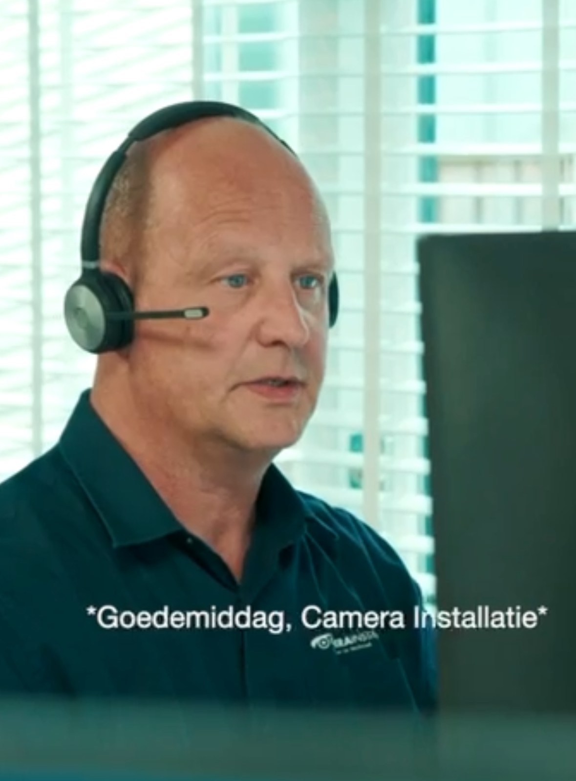 Koen answering with a headset at the service desk